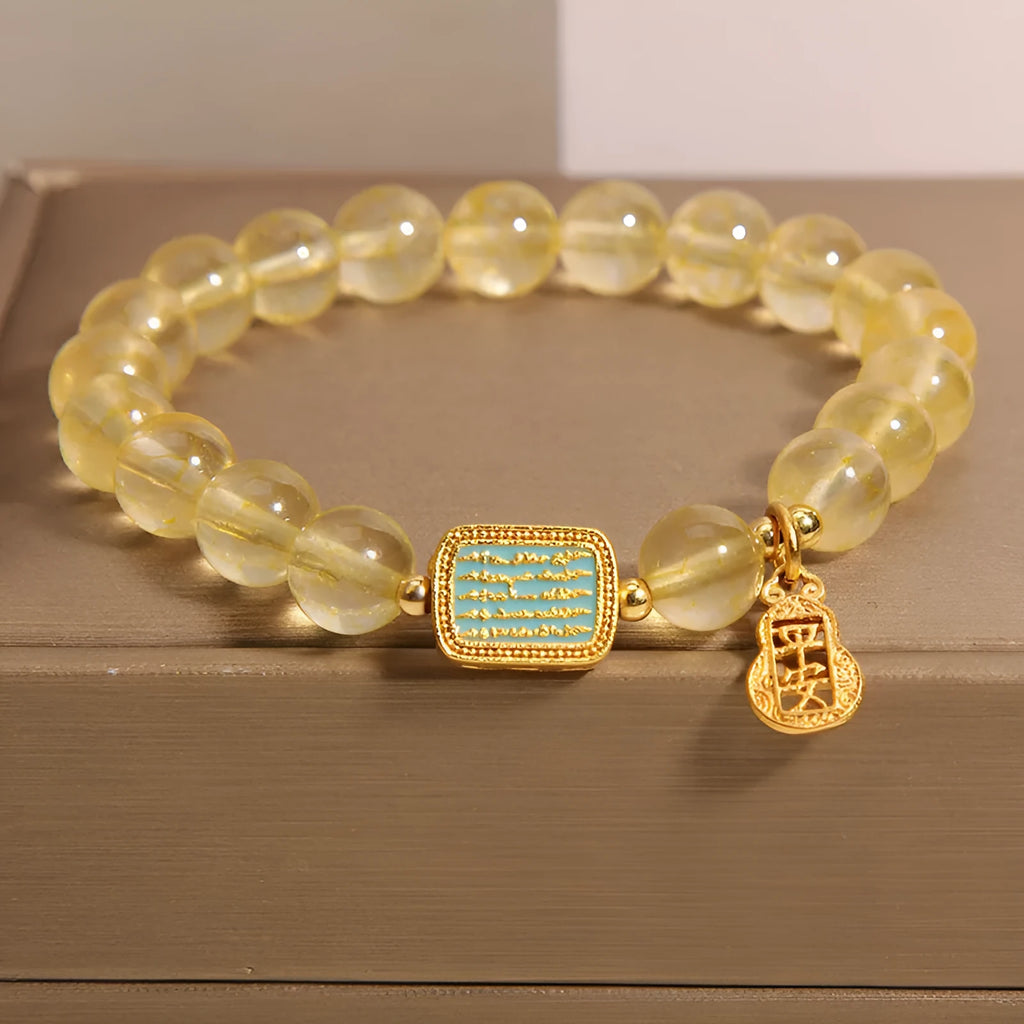 Women's natural yellow crystal bracelet with citrine colour tones and rhinestone decorative elements