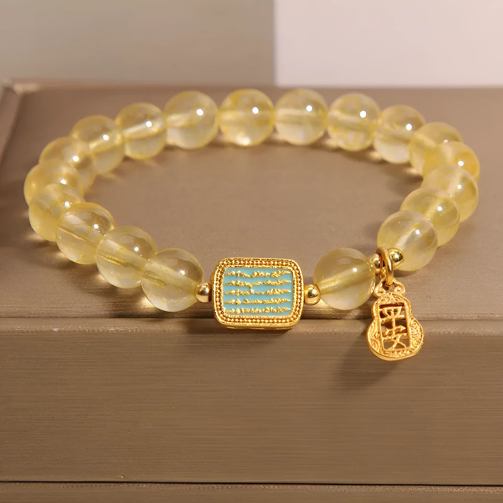Women's natural yellow crystal bracelet with citrine colour tones and rhinestone decorative elements