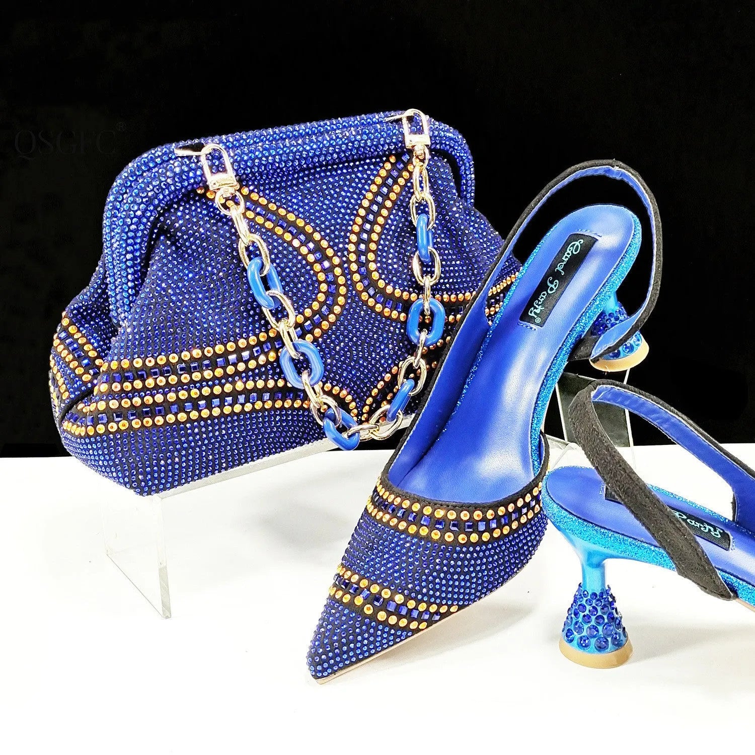 Women's pointed toe high heel shoes with rhinestone decoration and matching small bag in synthetic leather