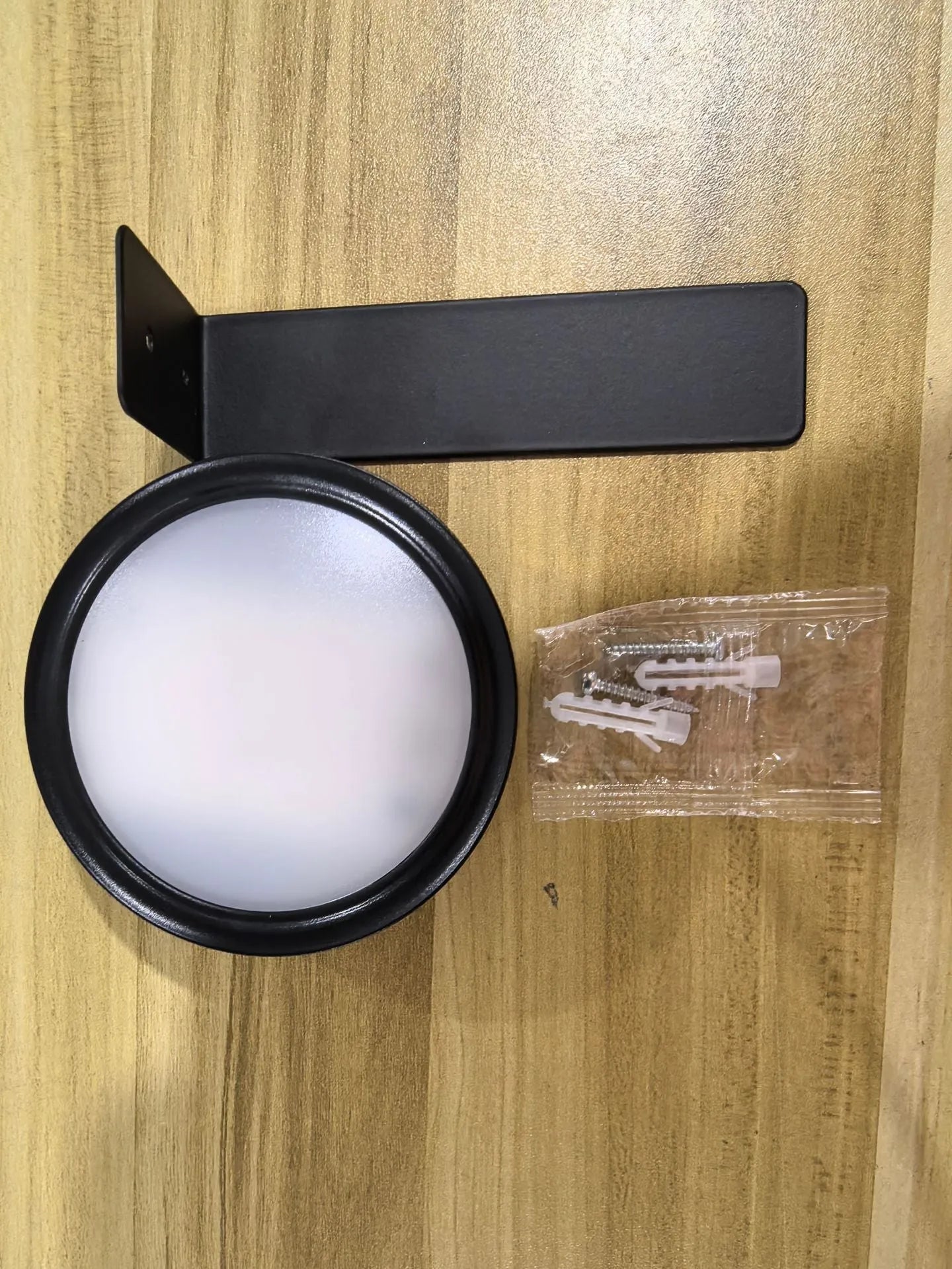 Wireless LED painting lamp with a magnetic mounting belt and remote control in black finish.