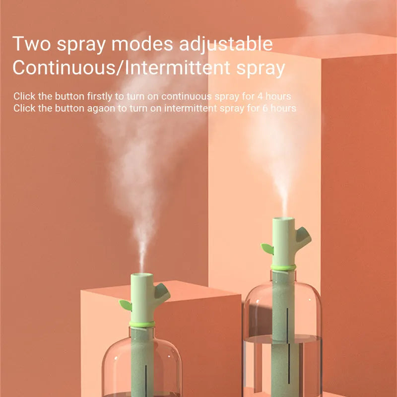 Transparent plastic USB humidifier with branch design and water visible inside