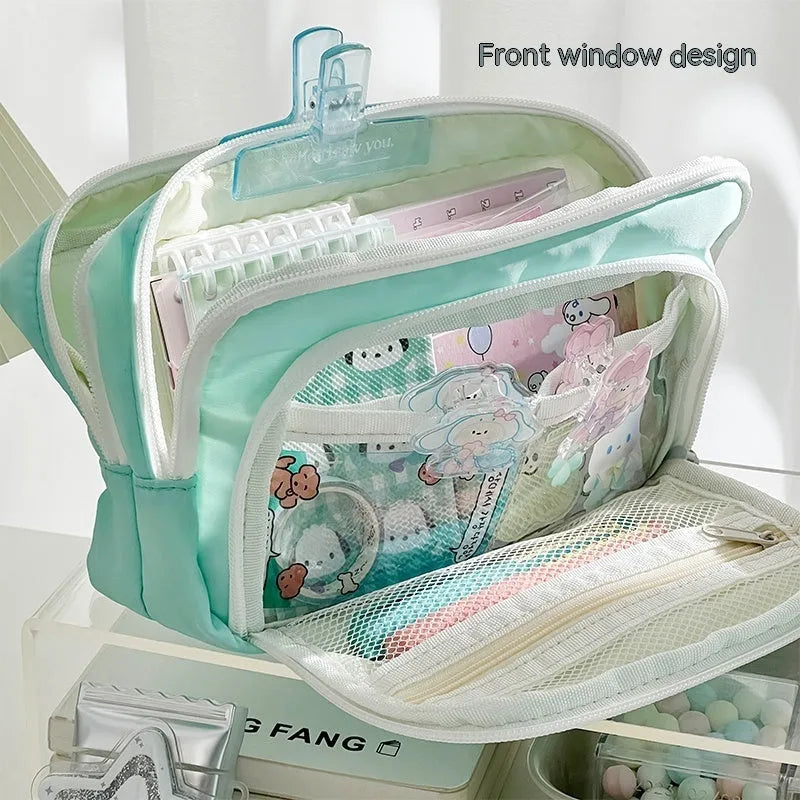 Double-layer pencil case in blue showing internal compartments and a top carry handle