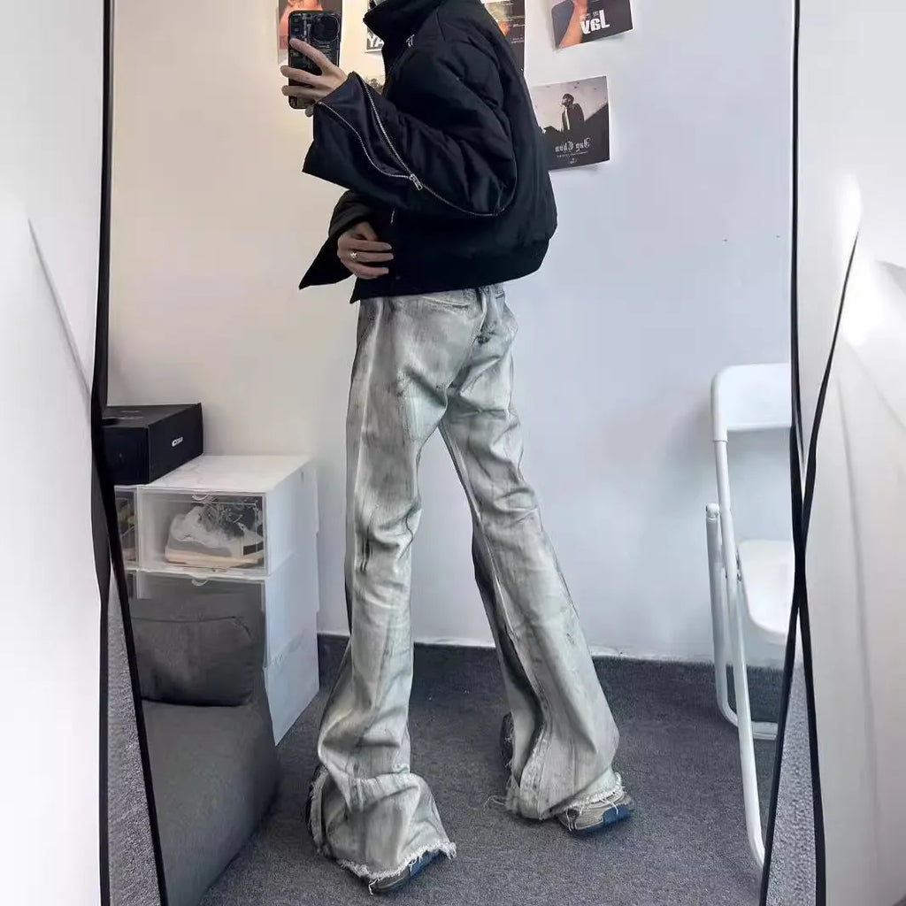White mid-waist cotton denim jeans with heavy selvedge detailing and black ribbon gradient across legs