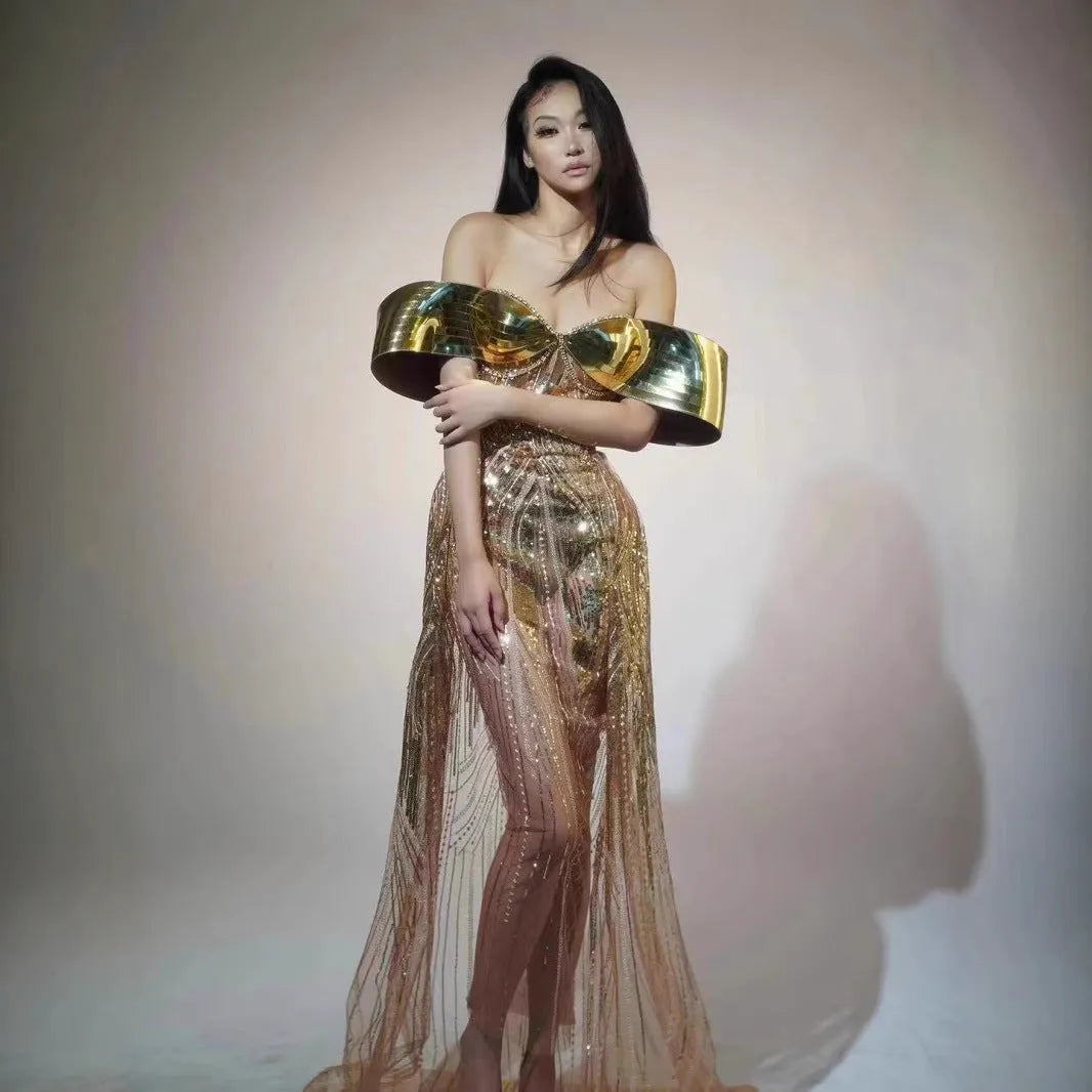 Gold sequined strapless long dress with a tulle skirt and high side slit.