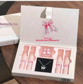 Butterfly Box makeup set with four pink lip mud pots, powder blusher, and necklace