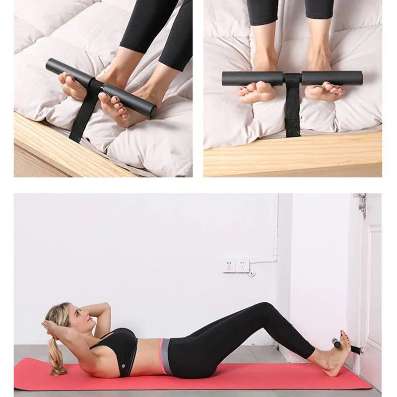 Black portable abdominal fitness device on a flat surface, showing steel frame with foam and PVC handles