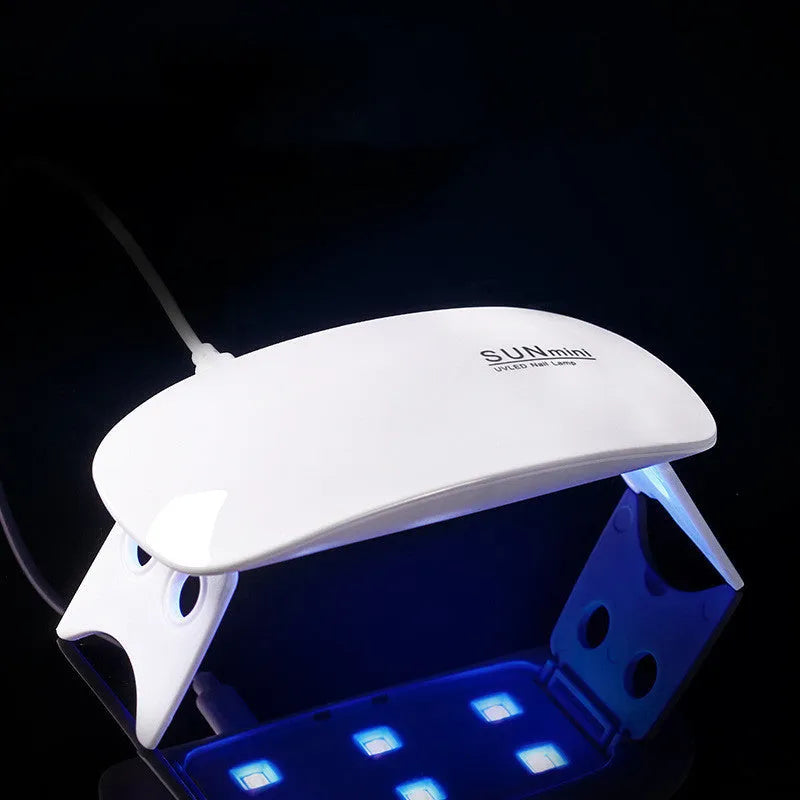 Mini Mouse pink LED phototherapy machine for nail gel curing with 6 lamp beads on a white surface