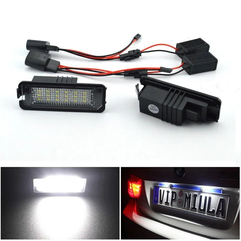 Two Volkswagen LED license plate light units with multiple white SMD LEDs visible.
