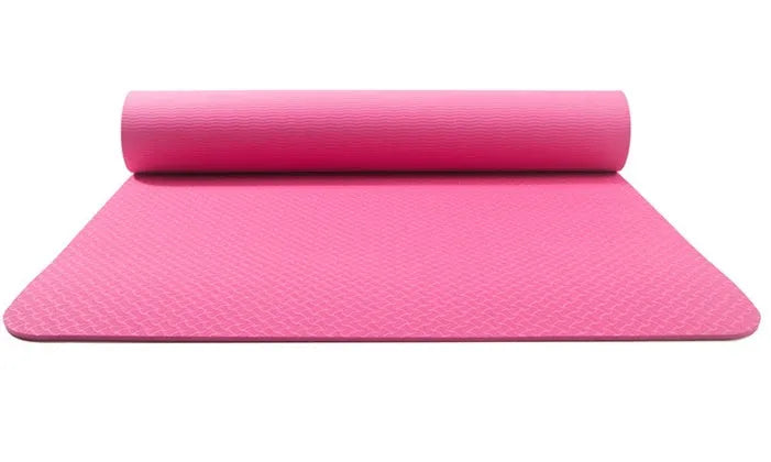 Pure colour EVA yoga brick, thick non-slip mat, and cotton tension band on a floor, in blue, purple, pink, red, black, gray