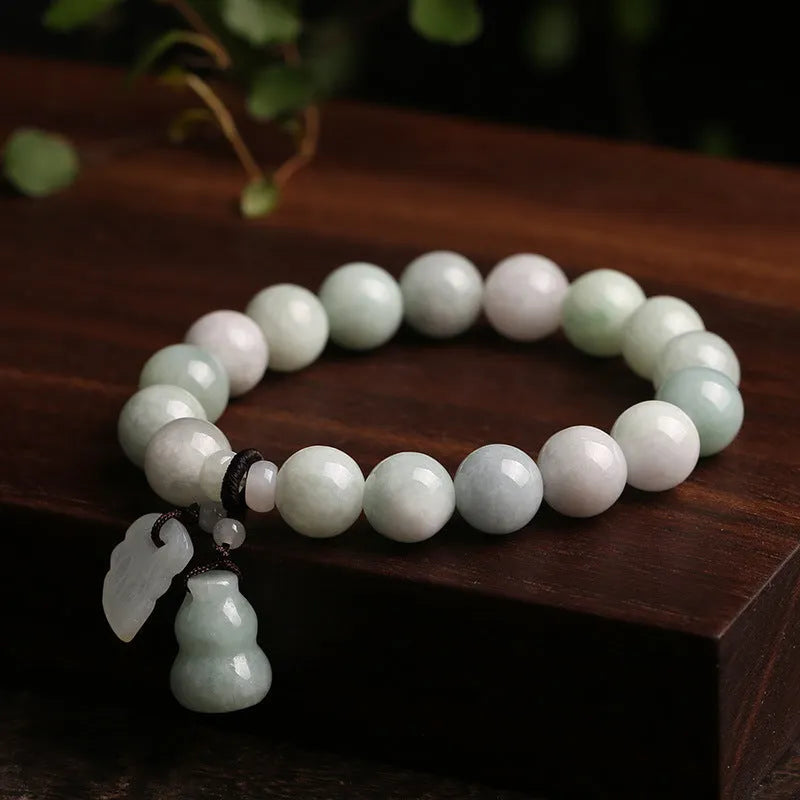 Natural green jade geometric bracelet with an adjustable chain and a hanging Maitreya Buddha charm.