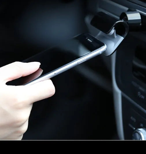 Black universal car phone holder showing 360-degree rotating bracket with 3M adhesive backing