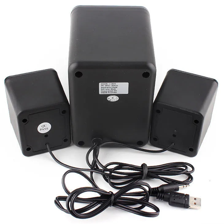 Green 2.1 USB computer speaker with LED lighting on desktop