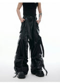 Black quilted leather trousers with multiple pockets and retro stitching details
