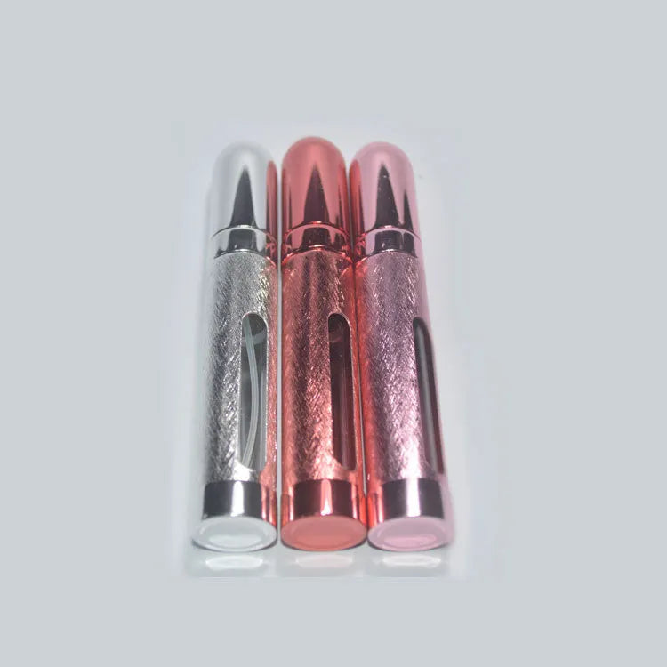 A slim, portable 12ml aluminium perfume bottle with a glass liner in choice of colours including blue, golden, pink, red, silvery, and violet.
