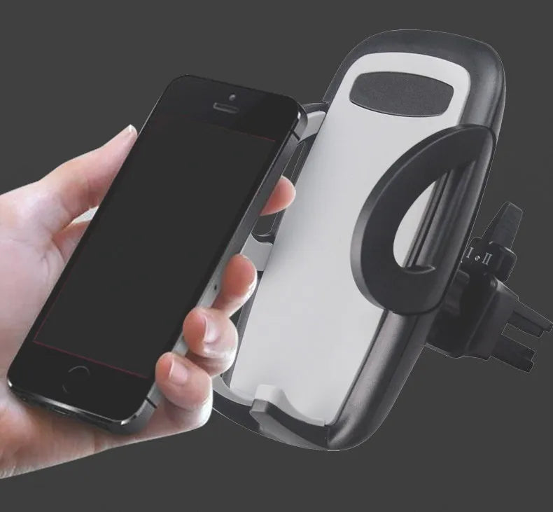 Black universal mobile phone holder attached to a car air conditioning vent.