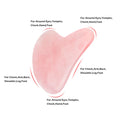Natural jade gua sha scraper in heart shape on a light surface, 6.3cm x 4.5cm, hand-polished stone