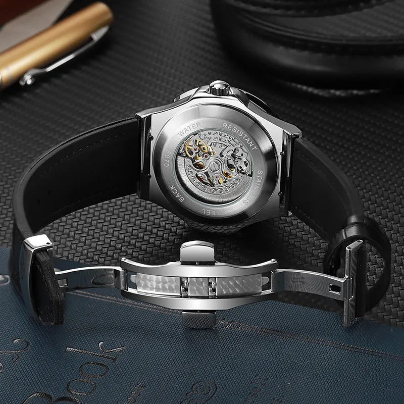 Automatic mechanical men's watch with hollow diamond-studded dial and 16mm white shell case.