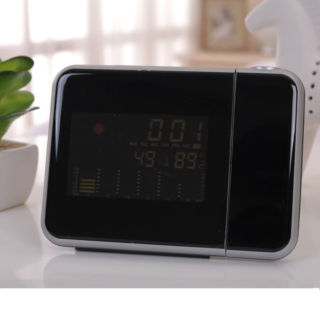Compact plastic home electronic clock with USB cable in black, dimensions 16 by 6 by 12 centimetres