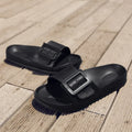 Women's grey blue EVA buckle slippers showing buckle detail and textured sole
