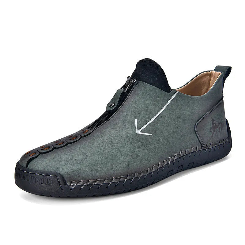 Men's black leather-look casual boot with front zipper, round toe, and mid-calf shaft.