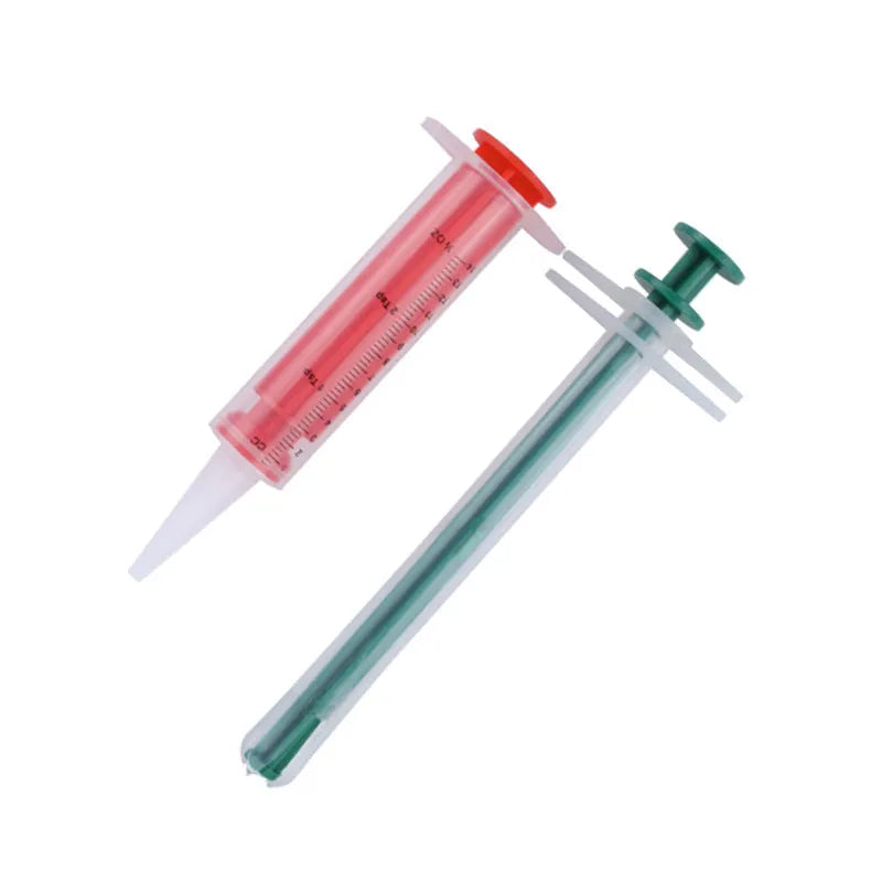 Two silicone pet pill shooter syringes with soft tips, one longer than the other, for administering tablets.