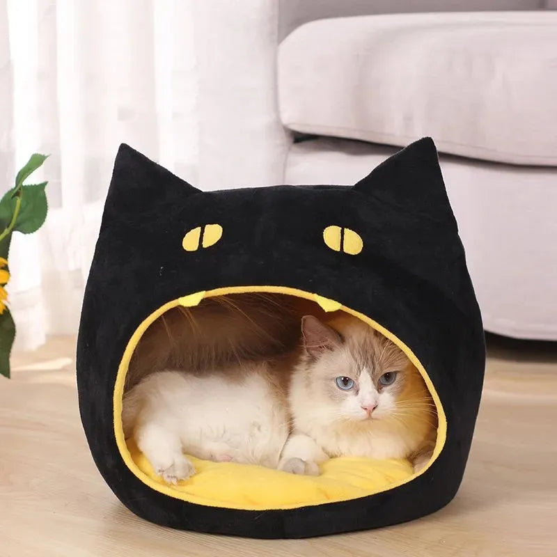 Soft warm cat bed in cat shape design with anti-slip bottom, machine washable, available in S and L sizes.