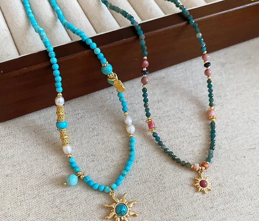 Freshwater pearl sun necklace on clavicle chain in court style, blue-sun colour option.
