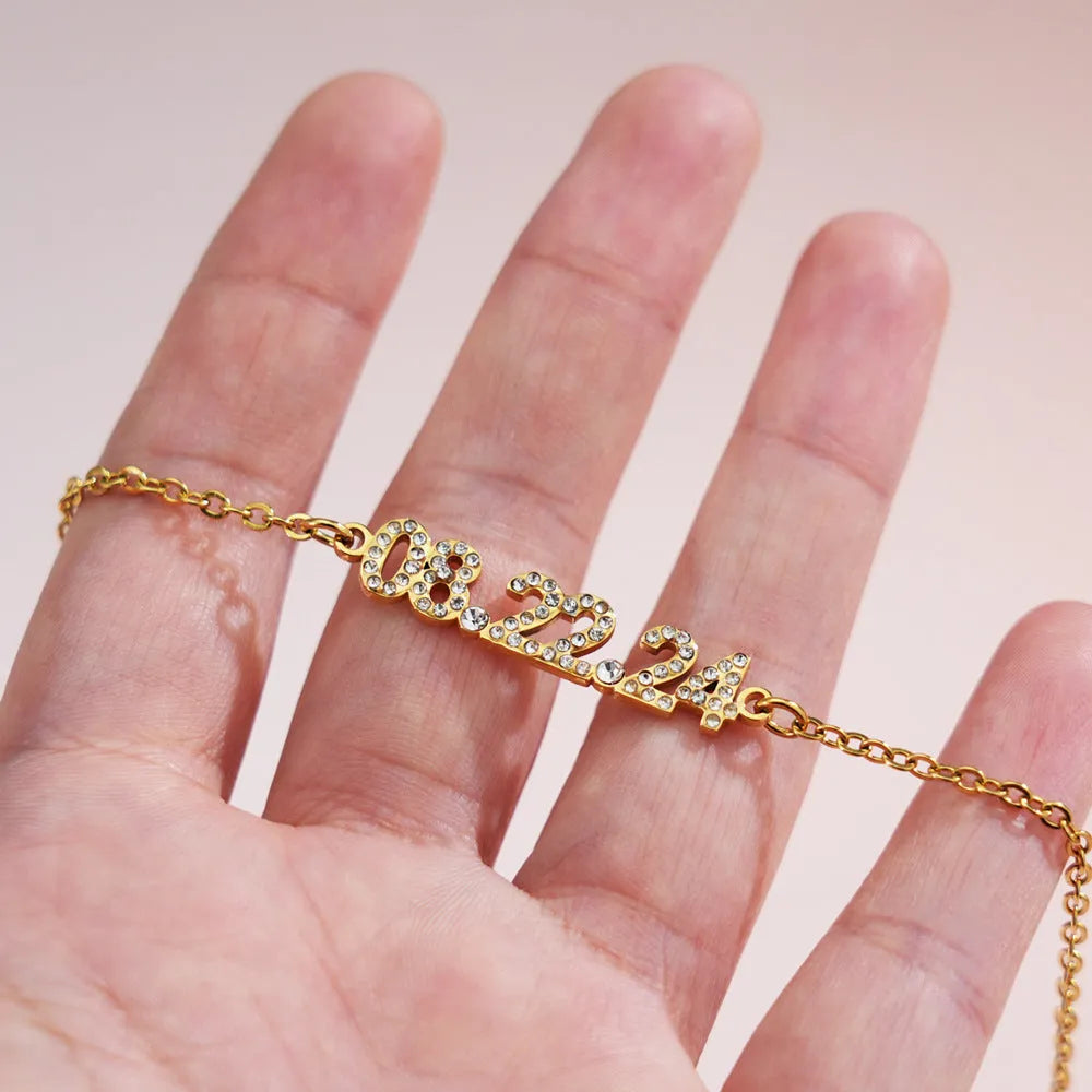 Stainless steel digital bracelet with diamond-set numbers on display, shown in rose gold, gold, and steel colour variants.