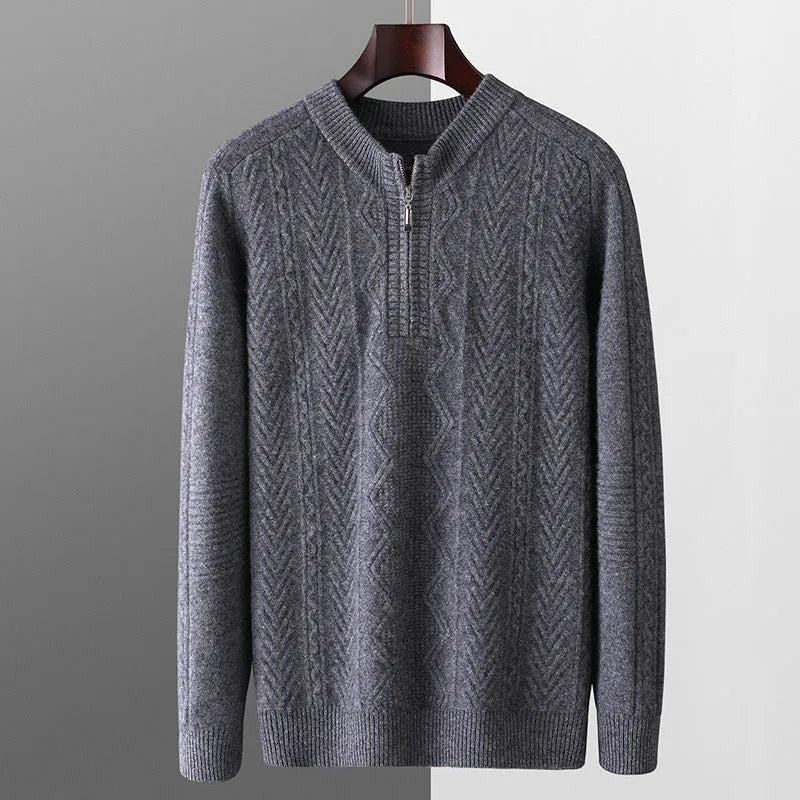 Men's grey wool half zip sweater with a diamond lattice pattern, shown on a model.