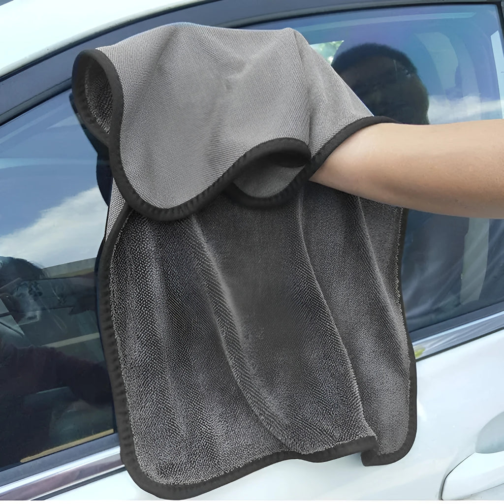 Grey square microfiber car wash towel for drying vehicles.