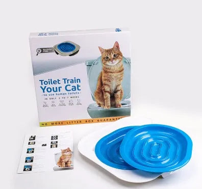 Blue cat toilet trainer with grooved removable trays placed on a white toilet seat