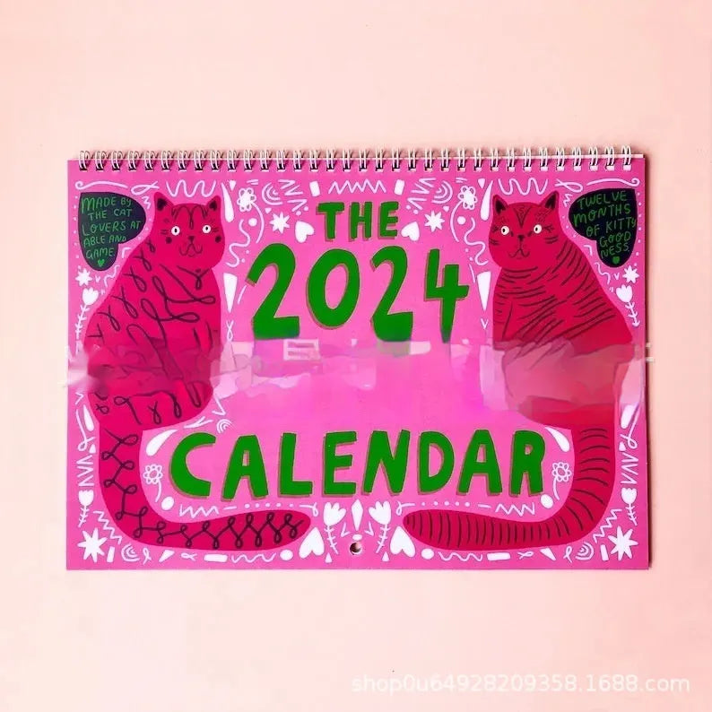 Cat calendar wall planner showing monthly grids with feline illustrations on A4 paper
