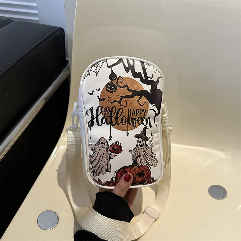 Black mini crossbody phone bag with Halloween graffiti print showing pumpkins, ghosts and bats
