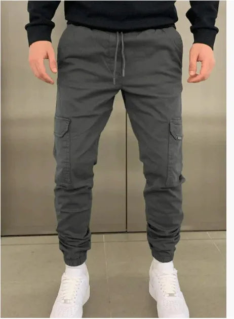 Men's light blue polyester baggy trousers with dimensional patch pockets and straight leg casual styling