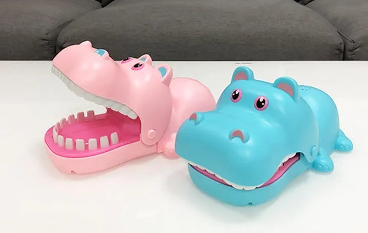 Multicoloured plastic bite hand animal interactive toy showing dog, crocodile, shark, and hippo designs
