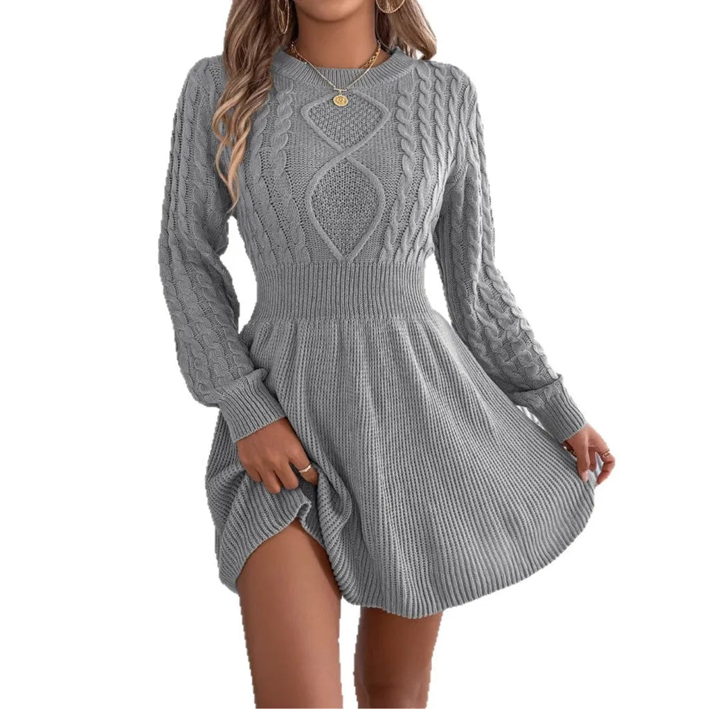 Long sleeve black sweater dress with lantern sleeves and an elastic waist, midi length.