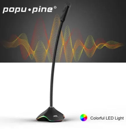 Black wired condenser microphone with built-in stand and pop filter sponge on a desk.