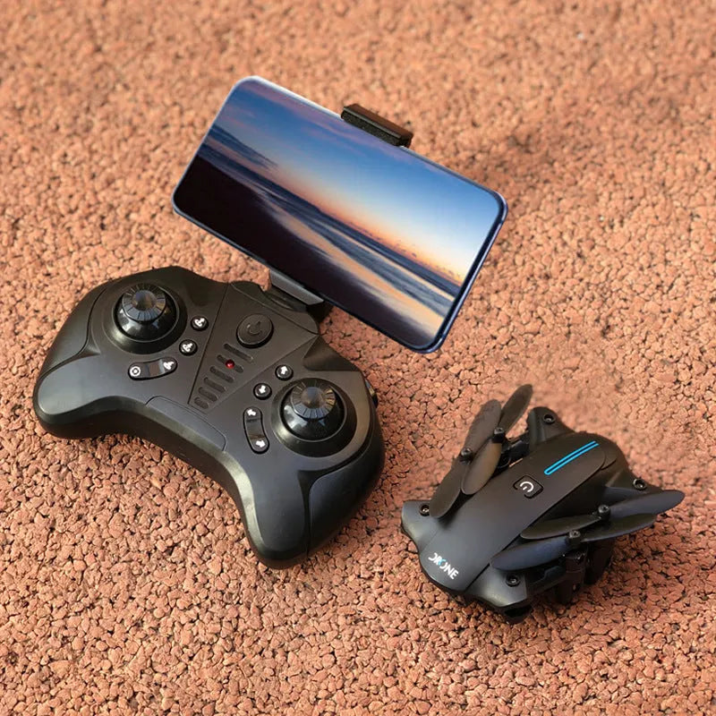 Mini folding drone with 4K camera in black, folded size 8x4x7cm, showing four rotors and remote controller