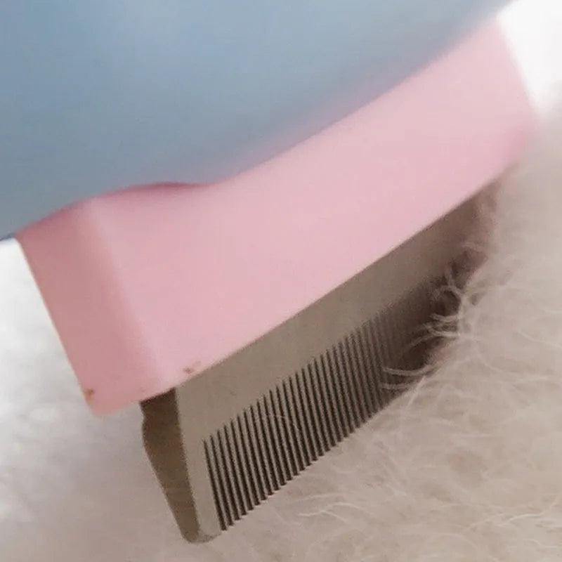 Blue double-sided pet grooming brush with deshedding rake and dematting comb on a wooden surface.