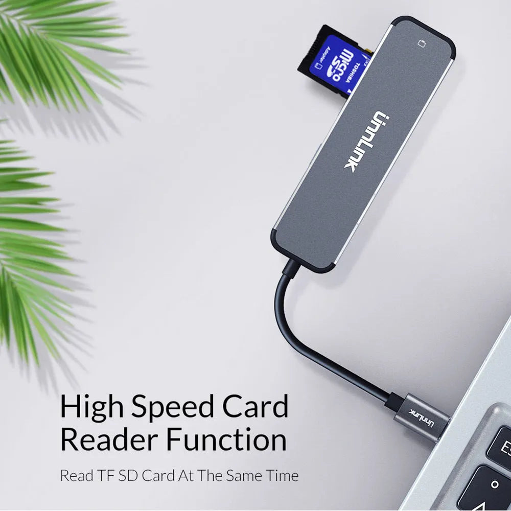 Silver aluminium alloy USB-C docking station with HDMI, SD/TF, and USB 3.0 ports