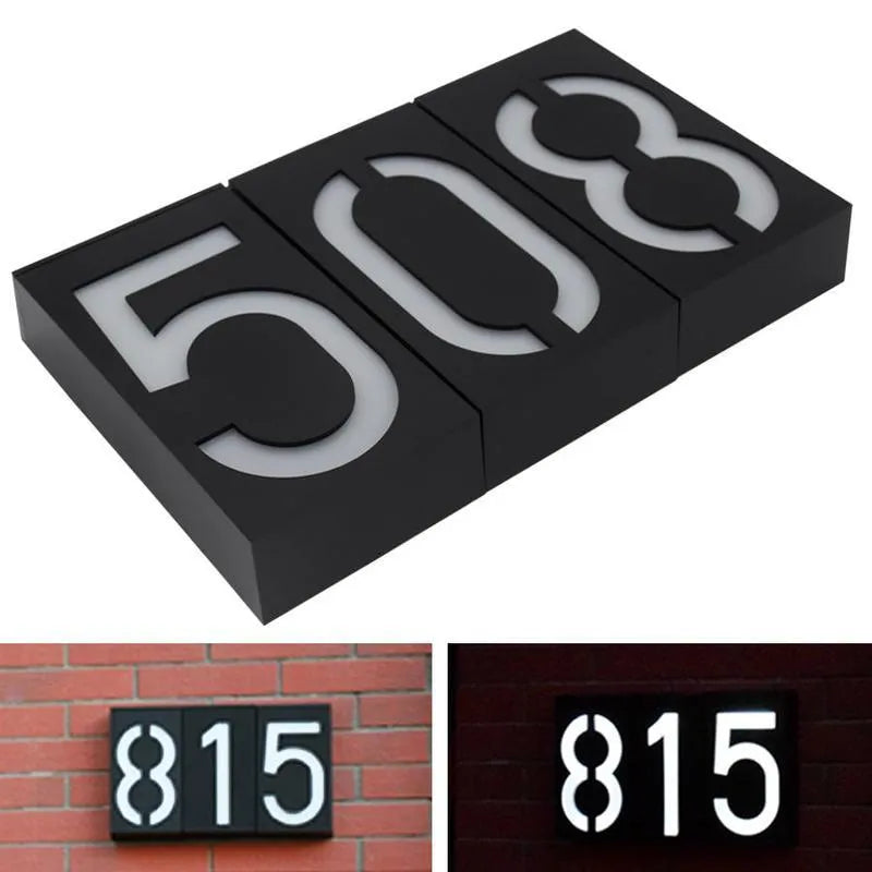 Solar powered outdoor house number light with white LEDs and wall mount.