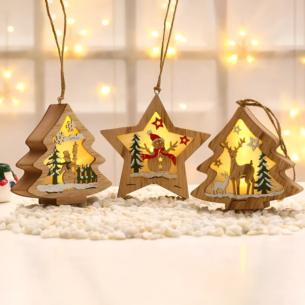 Set of four laser-cut wood Christmas decorations with polychromatic colouring: tree-shaped old man, snowman, deer, and five-star snowman on a festive table