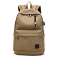 Canvas backpack with USB charging port showing laptop compartment and multiple pockets