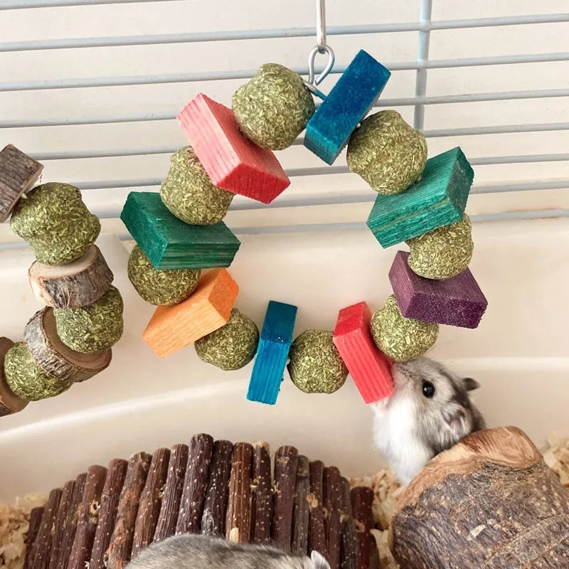 Colourful hamster chewing toy with straw ball rings and applewood rods for small pet dental health