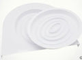 Blue cat toilet trainer with grooved removable trays placed on a white toilet seat