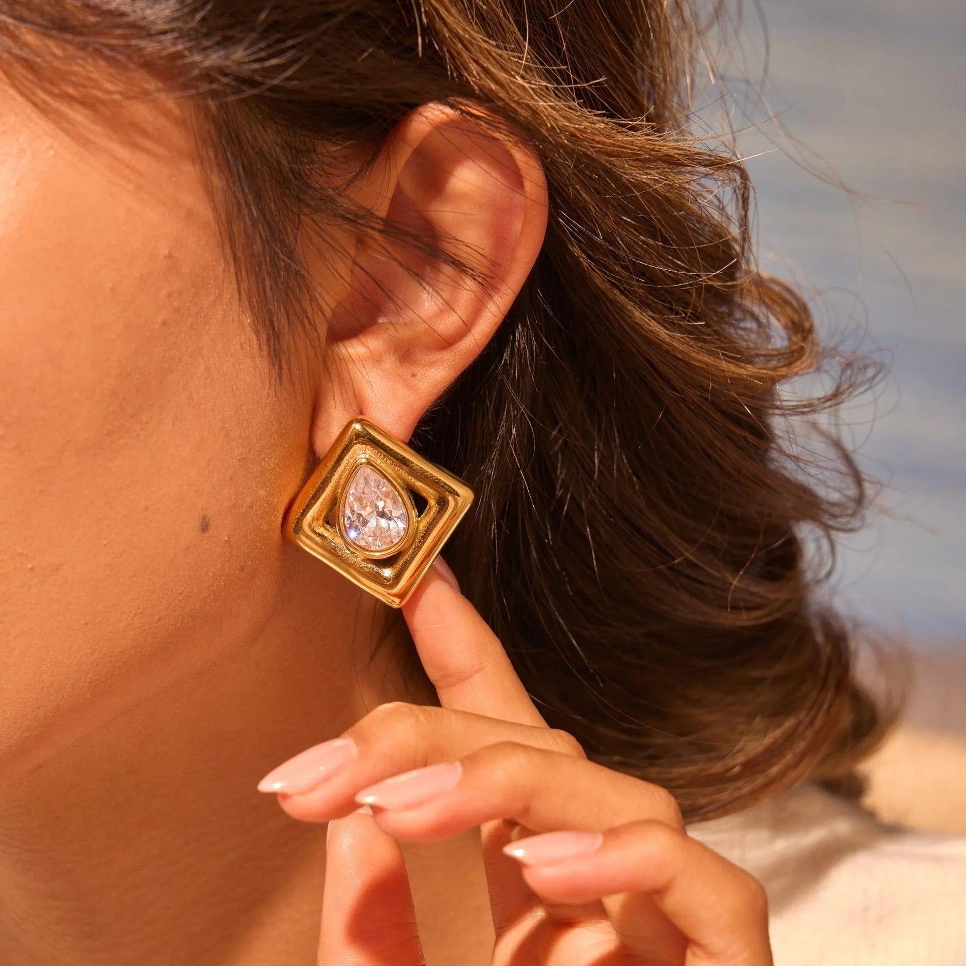 Geometric stainless steel stud earrings with water drop zircon stones in 18K gold colour