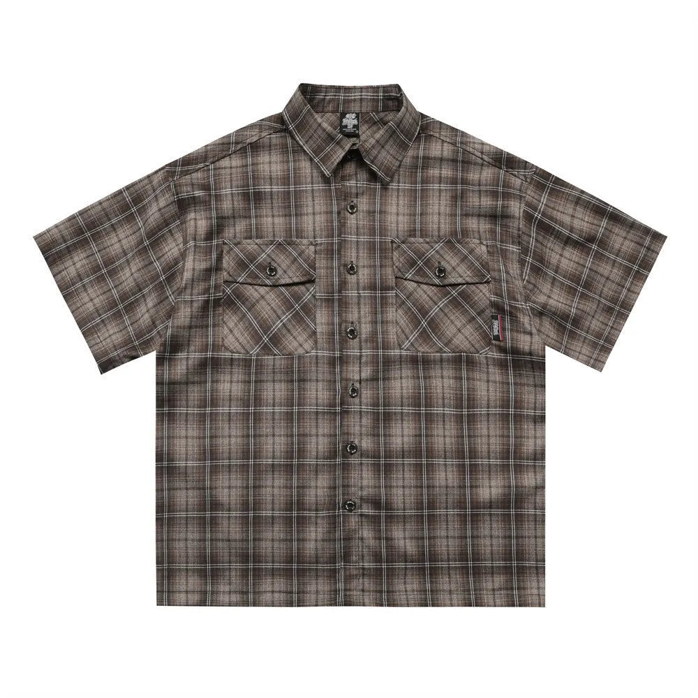 Men's black and brown plaid short sleeve shirt with embroidered letter and lapel collar.