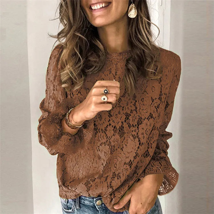 Women's green loose-fit lace shirt with hollow-out detailing and a zip, long sleeves, and a round neck.