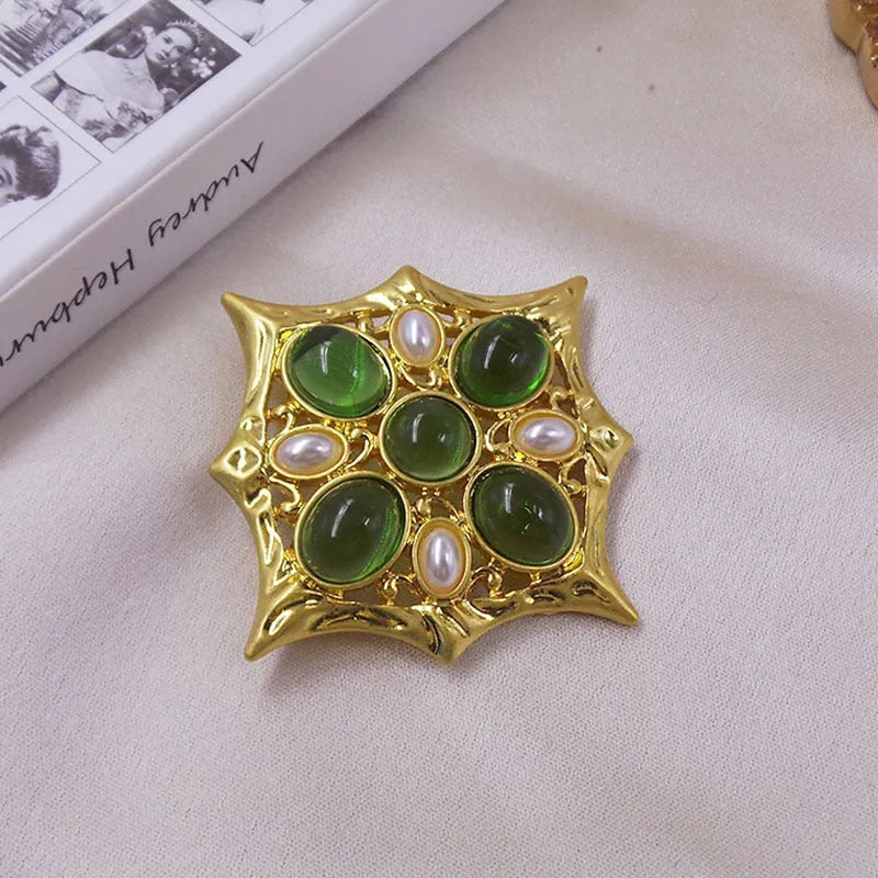 Medieval baroque crystal cross brooch in zinc alloy with ornate design on dark background