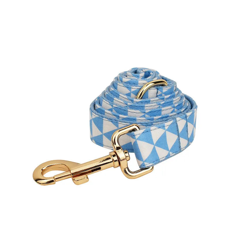 Blue triangular ring rope dog harness set with collar, lead, decorative bow and vest on cloth material